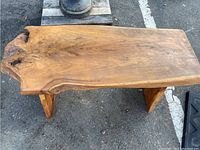 Top view of the bench showing full live edge top surface and natural wood grain.