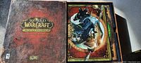 Outer collector's edition box with World of Warcraft Mists of Pandaria embossed title and textured reddish-brown design