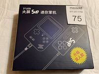 Box front showing the Sup brand handheld gaming system with 3 inch LED screen and connected wired controller illustration.