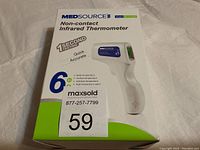 Box of MedSource Non-contact Infrared Thermometer showing front and side with model number MS-131001 and key features such as 1 second quick testing and 6 measurement types.
