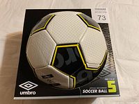 New Umbro soccer ball in original packaging, size 5, suitable for ages 12 and up, showing front view of ball and logo.