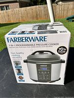Box of Farberware 7-in-1 Programmable Pressure Cooker showing front view and branding.