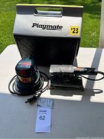 Lot shown with Playmate cooler in background, sander and polisher in front on white surface