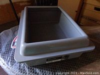 Gray plastic litter box viewed from above showing size and design