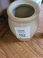 Top view of the ceramic crock showing the small chip on the rim and overall condition.