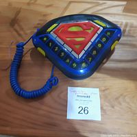 Top view of Superman table phone, showing push buttons and Superman emblem.