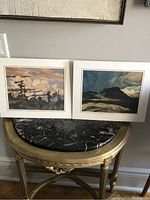 Two framed Artagraph reproduction prints showing Group of Seven art style landscapes, approx 11x12 inches.