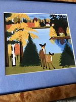 Close-up of the print area showing deer and landscape with printed signature “L. Lewis.”