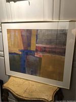 Full view of framed abstract painting “Meeting Shapes”