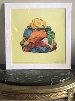 Full view of the framed and packaged art print showing the colorful Play-Doh sculpture on a pale yellow background.
