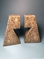 Front view of the pair of green marble bookends showing their size, shape, and marble veining.