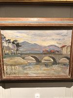 Full view of framed painting showing scene and frame details