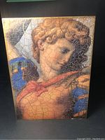 Front view showing crackled portrait design