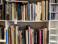 Shelf of books focusing on Picasso, Mexican art and other painters including Forever Picasso and Max Beckmann.