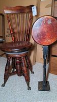 Victorian wooden spinning chair with brass ball and claw feet, showing front and side angles.