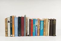 Photo showing 24 books arranged in a row with visible titles related to exploration, adventure, and historical sea events including Titanic and Arctic expeditions.