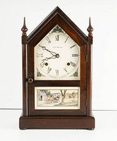 Front view of the antique New Haven mantle clock showcasing the white clock face with Roman numerals, decorative corners, and a lower panel with a painted rural scene.