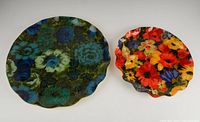 Pair of Mid Century Modern Hardy-Glenwood serving trays showing floral patterns and scalloped edges.