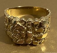 Close-up front view of ring showing irregular nugget texture