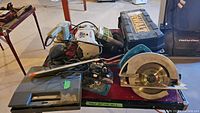 Overall lot of power tools including power saw, black DeWalt case, ShopCraft bench grinder, sanders, and soldering tool case