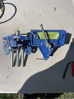 Two blue MasterCraft table vice grips on a white surface side by side