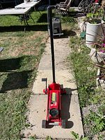 Front view of jack in lowered position with handle