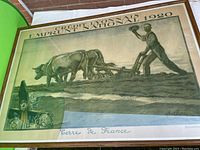 Front view of framed vintage print showing farmer plowing with oxen, titled 'Credit Lyonnais Emprunt National 1920' signed Devanbez-paris