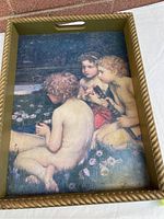 Top-down view of the wooden tray showing the vintage painting of children by a pond, with olive green and gold-colored edges and cutout handles.