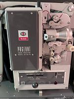 Close-up of front and side of Kodak Pageant 16mm sound projector showing model and controls.