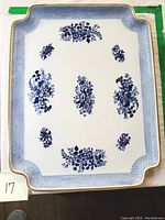 Top view of the rectangular Copeland ceramic tea tray showing blue floral decorations and scalloped gold-trimmed edges.
