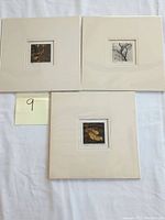 Overview of three matted intaglio prints by Haku Maki laid out