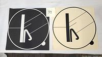 Both lithographs side by side on cloth background