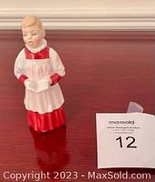 Front view of the Royal Doulton choir boy figurine showing detailed face and choir robe.