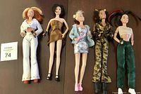 Full view of all 5 Spice Girls dolls in their distinctive outfits, holding microphones