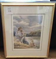 Framed art print in a gold-toned frame showing the full image with the mother and children by the water watching a rowing event.