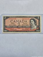 Front of 1954 Canadian $2 banknote showing Queen Elizabeth II portrait, serial number BB3161046 in red, and denomination markings.
