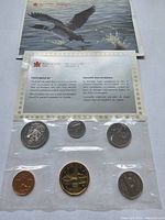 Front view of sealed 1993 Canadian proof coin set with certificate showing eagle artwork and coin details in plastic packaging.
