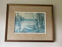 Front view of vintage Kierstead painting showing lakeside scene with birch trees, framed under glass with beige textured mat and wooden frame.