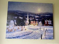 Front view of the winter village artwork in daylight showing the detailed snowy landscape and buildings.