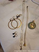 All items laid out on fabric background showing entire lot