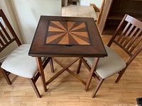 Assembled table and four chairs arranged around