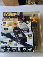 Front view of T-GRIP branded ratchet tie-down set packaging highlighting the ratchet tool and product specifications.