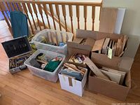 Wide shot showing all boxes and bins with assorted woodworking tools and materials