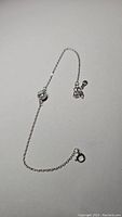 Full view of the moissanite bracelet showing chain, gemstone centerpiece, and clasp.