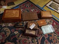 Overview of all eight boxes showing variety in size, wood patterns, and presence of glass box