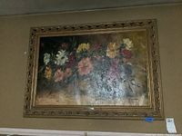 Full view of original oil painting with floral subject, showing ornate gold-tone frame and overall condition.