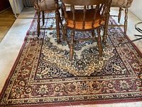 Full view of rug under dining table and chairs showing overall pattern and size