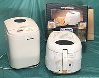 Breadman bread maker and DeLonghi Rotofryer fryer shown together with the fryer box in background