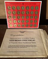 Original certificate paper indicating the complete 35-piece solid bronze coin collector's set from Franklin Mint (1968).