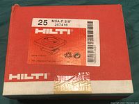 Red and white Hilti box with label showing 25 pieces of MSA-F 3/8" clamps, product number 257416